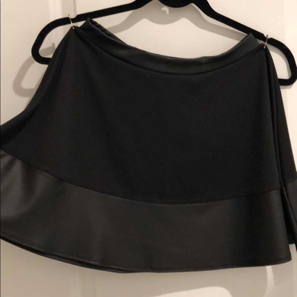 Black circle mini skirt with vegan leather trim